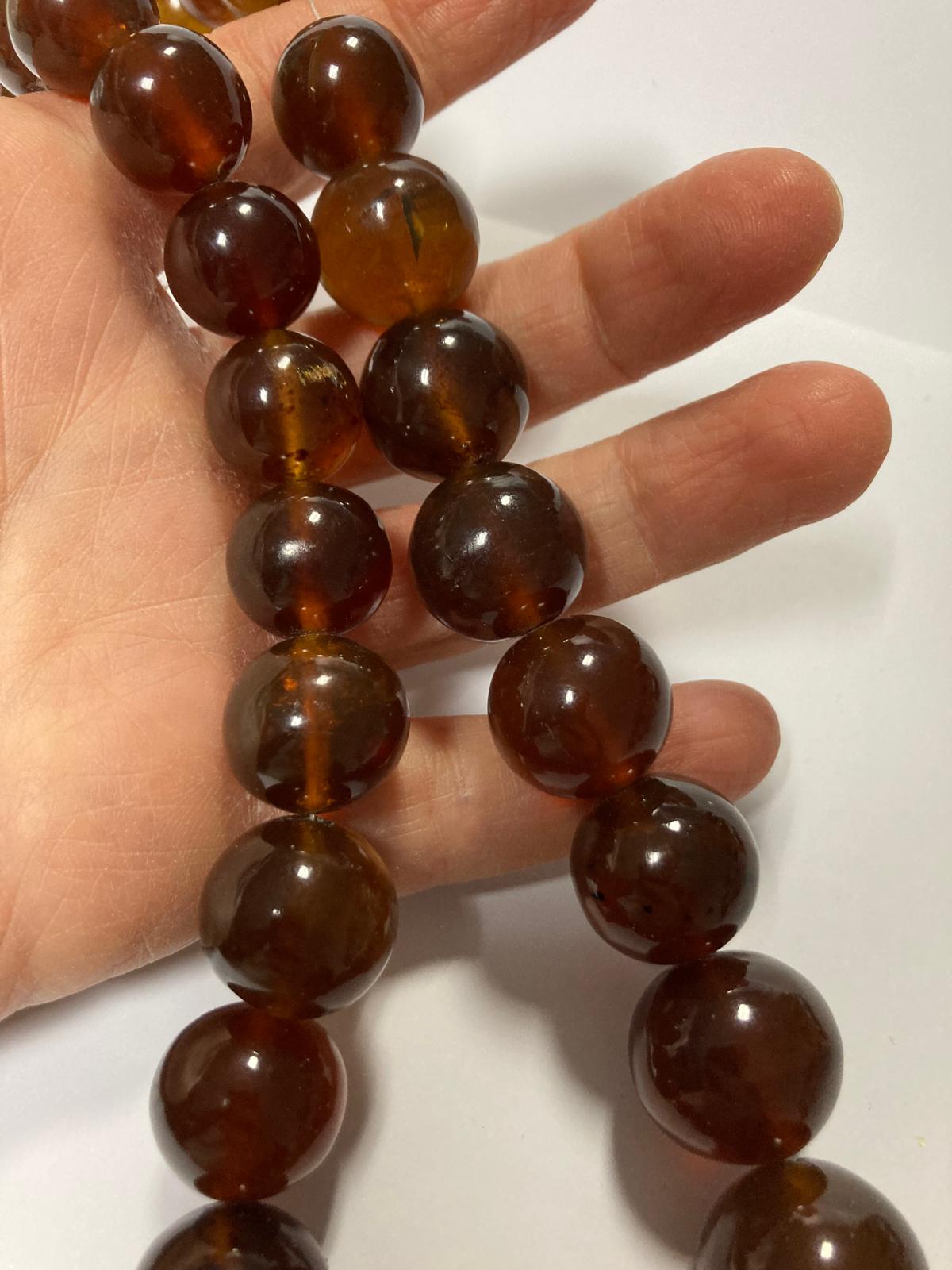 Ambra di sumatra sferica cognac