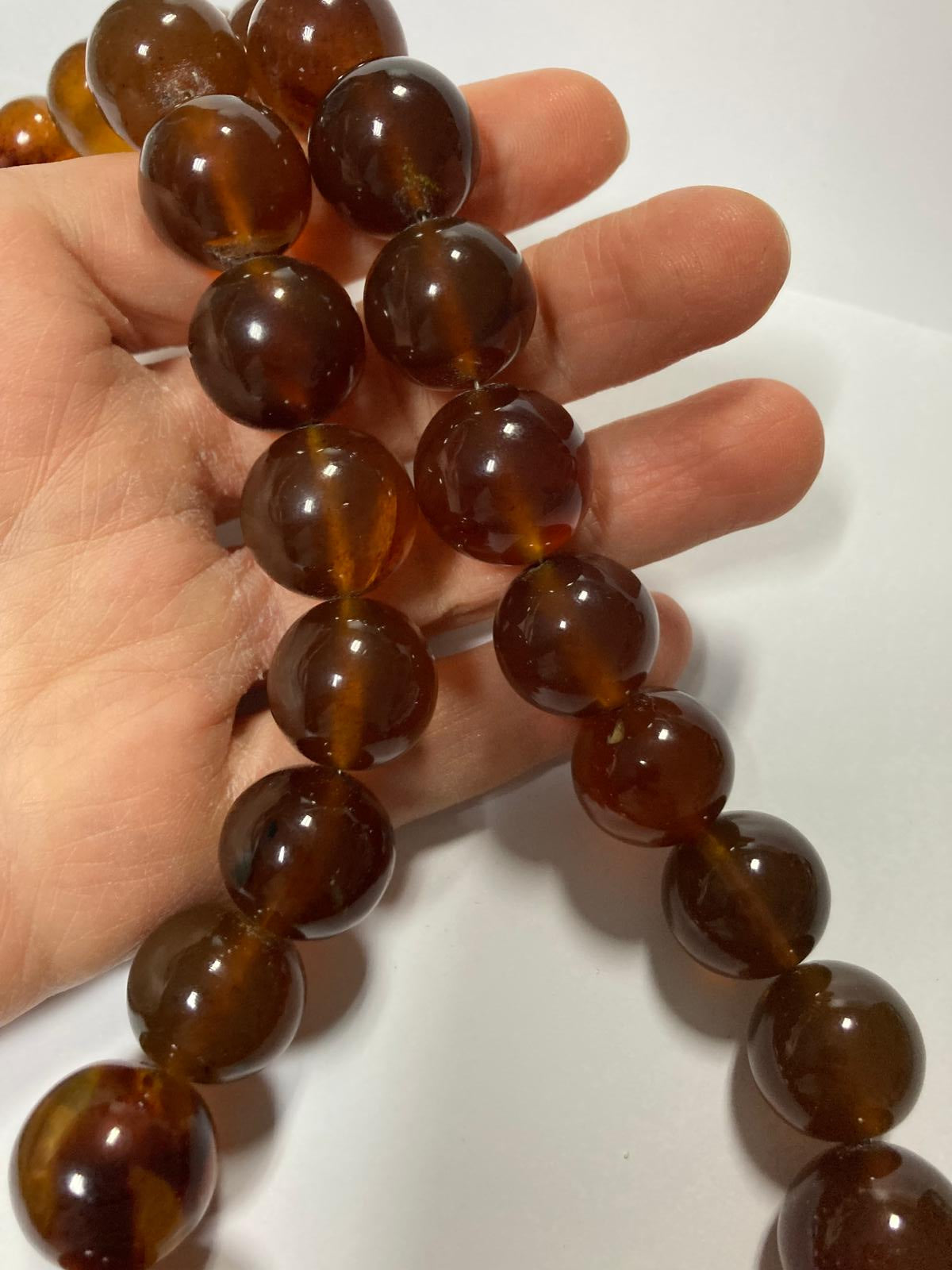 Ambra di sumatra sferica cognac