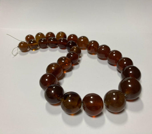 Ambra di sumatra sferica cognac