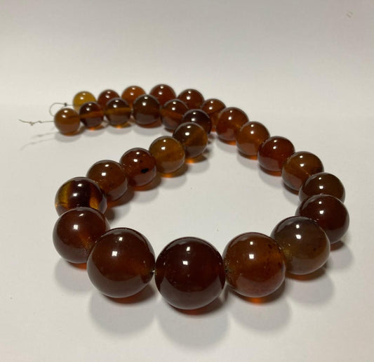Ambra di sumatra sferica cognac