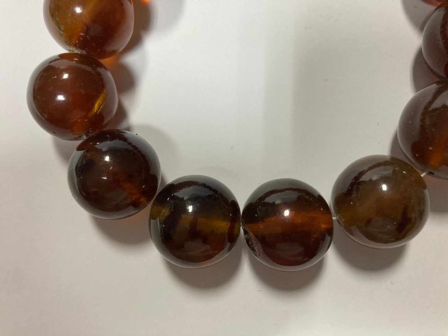 Ambra di sumatra sferica cognac