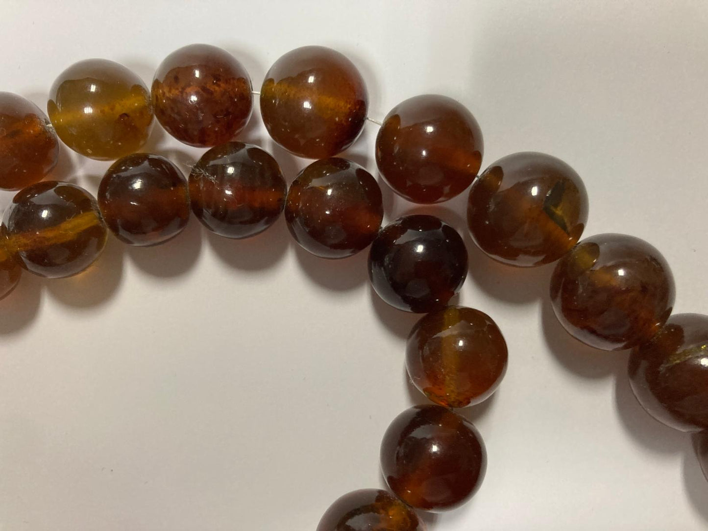 Ambra di sumatra sferica cognac