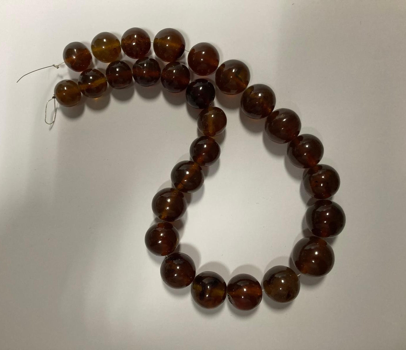 Ambra di sumatra sferica cognac